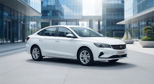 A white sedan parked in a modern urban setting.